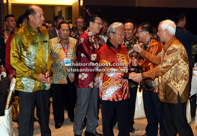 Masing (front second right) arrives at the BIMP-EAGA gala dinner together with Liow (behind Masing).