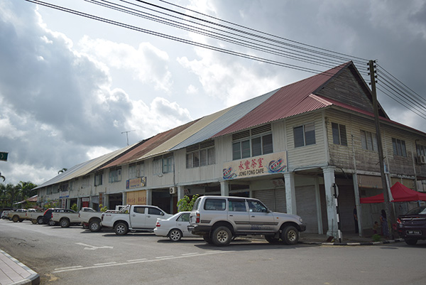 The last row of wooden shophouses. 