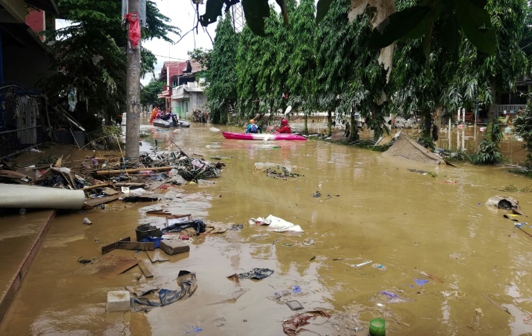  Indonesia floods leave two dozen dead several missing 